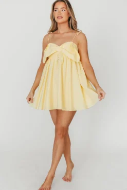 Discount Worth Collective Irelyn Babydoll Mini Dress with Bow Accent in Yellow