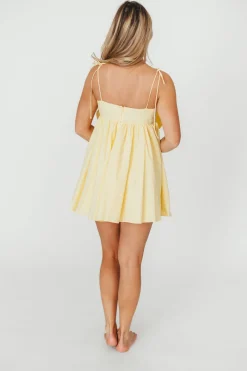 Discount Worth Collective Irelyn Babydoll Mini Dress with Bow Accent in Yellow