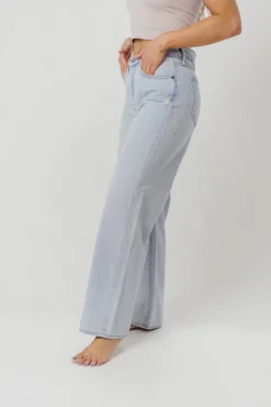 Fashion Worth Collective Nori Lightly Distressed Stretch Denim in Light Wash