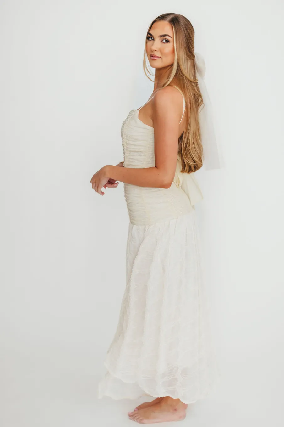 Fashion Worth Collective Rosie Ruched Maxi Dress With Bow Back Detail in Cream
